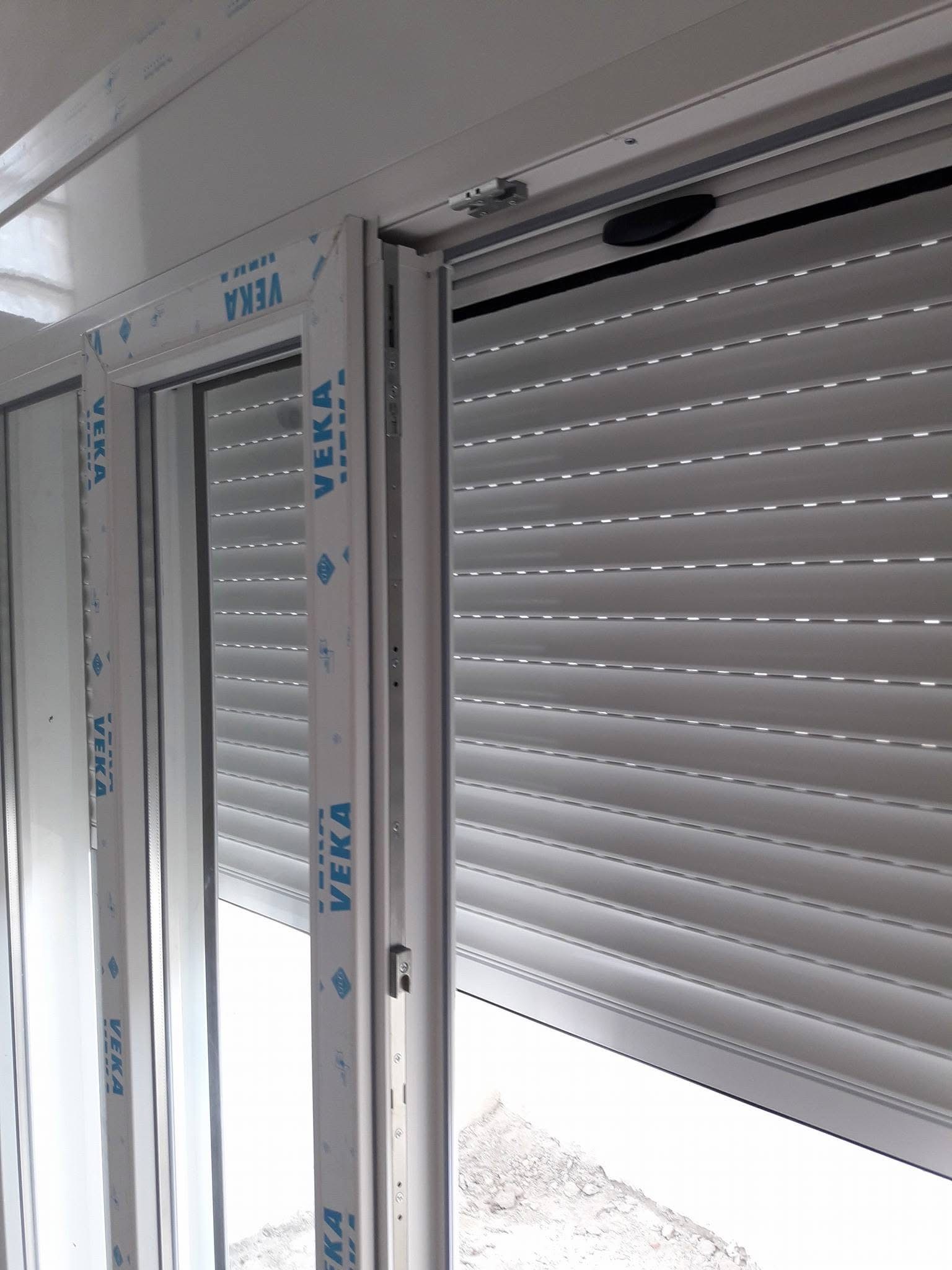 Interior view of a roller shutter on a white window system